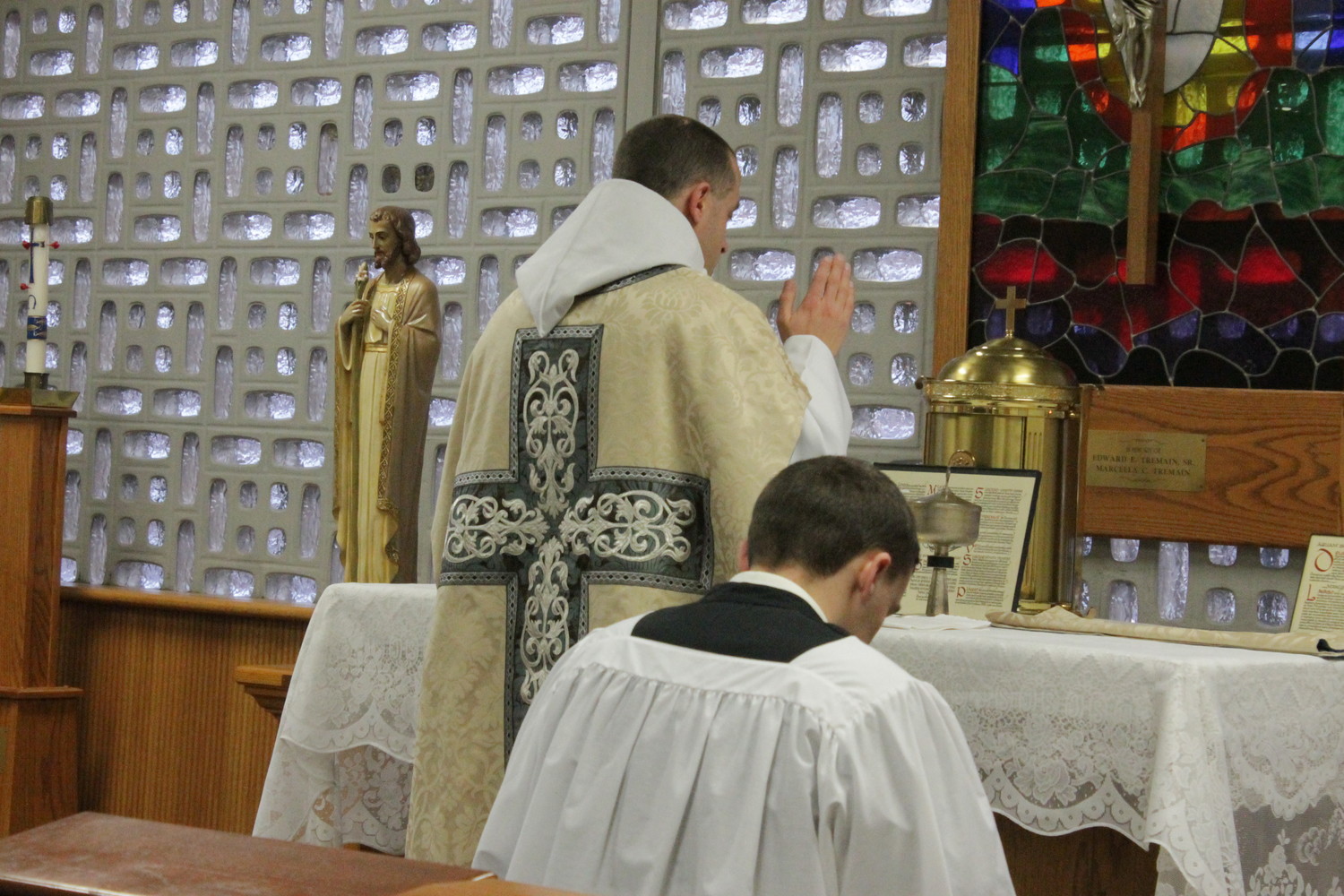 Jefferson City native Father Patrick Carter, standing, a priest of Our Lady of Clear Creek Abbey in Oklahoma, offers Mass in the extraordinary form at Helias Catholic High School in 2016.